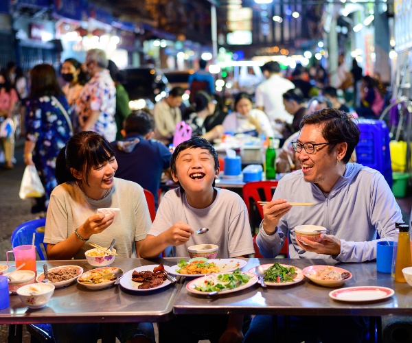 Family eating in Yaowarat, Bangkok