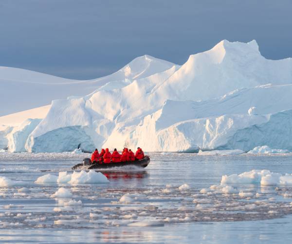 Zodiac past blue glaciers and through stunning fjords